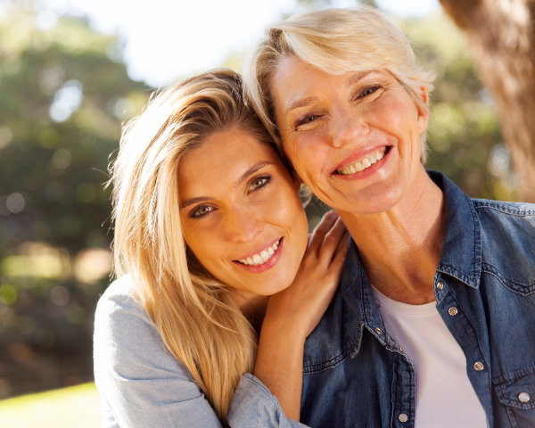 middle aged blond mother and adult daughter
